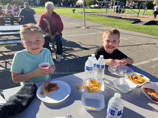 Students enjoying fall food.